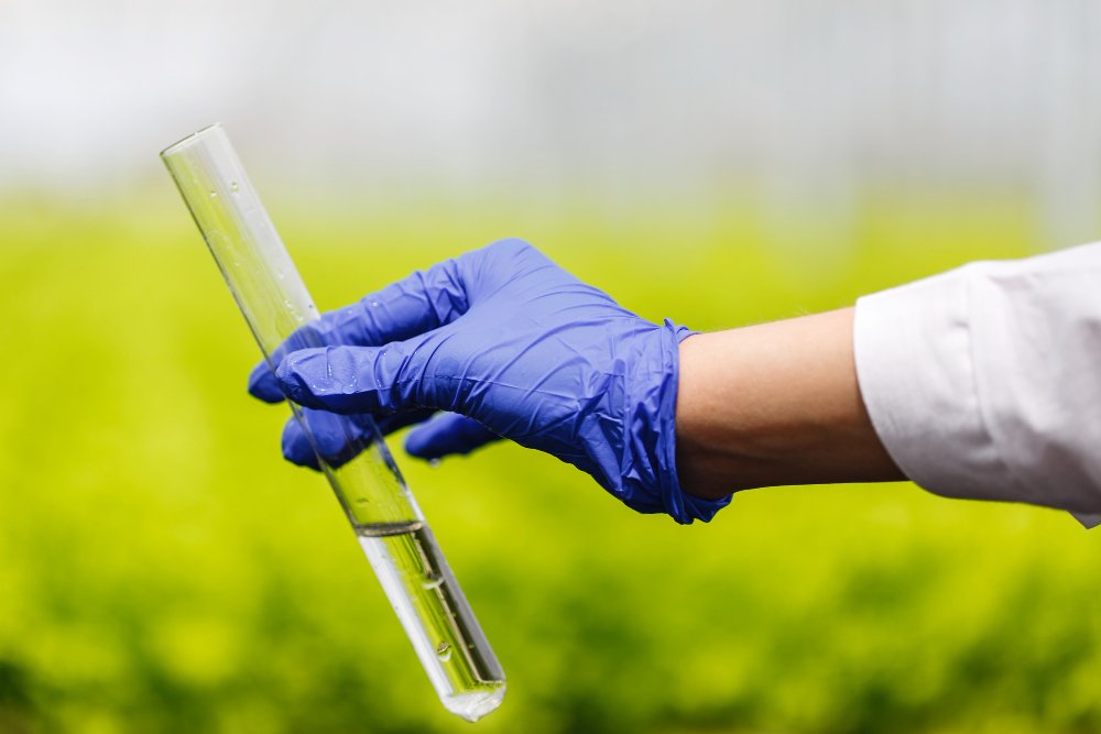Scientist holding environmental sample tube